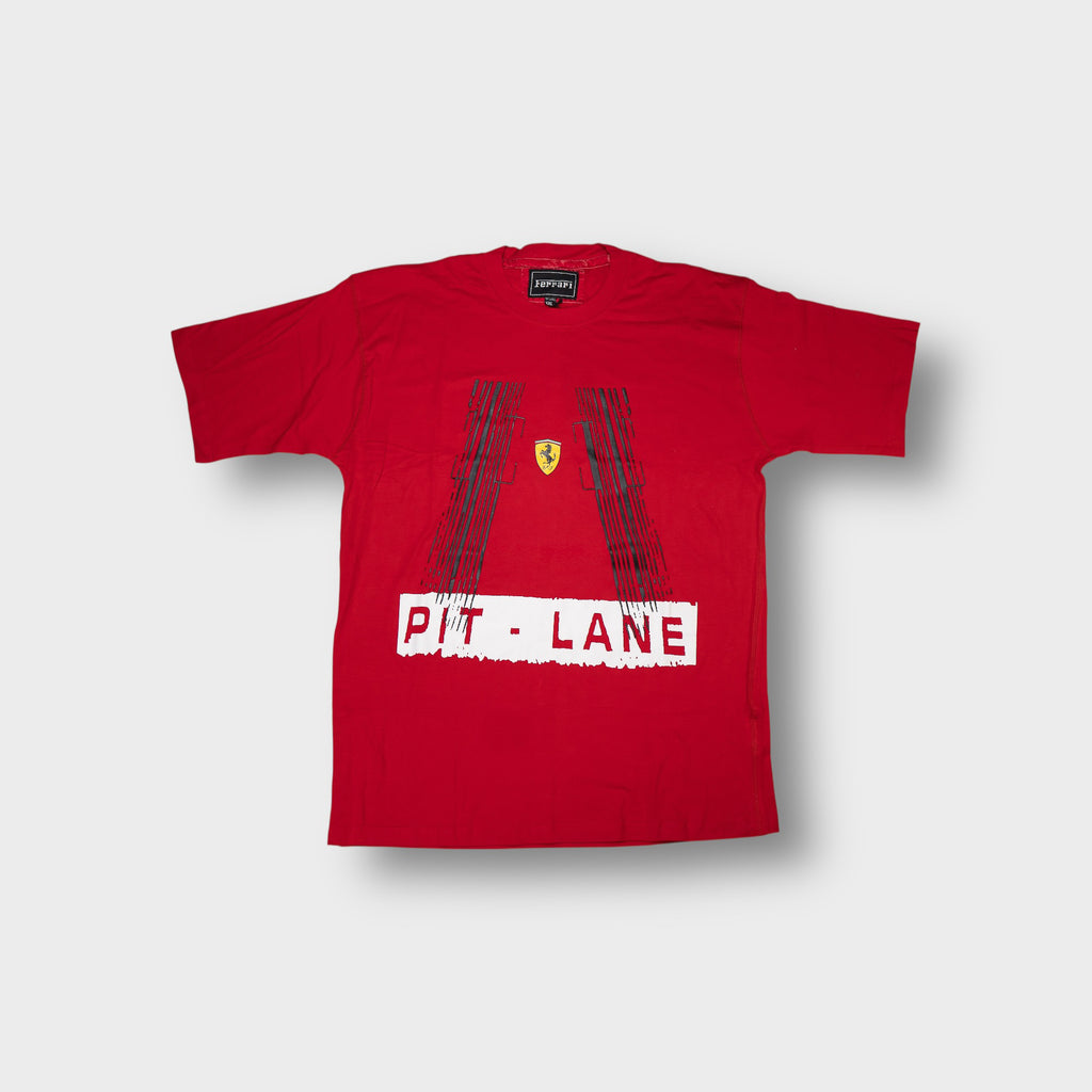 Ferrari T-Shirt in red featuring a Pit Lane print with black tire tracks and emblem.