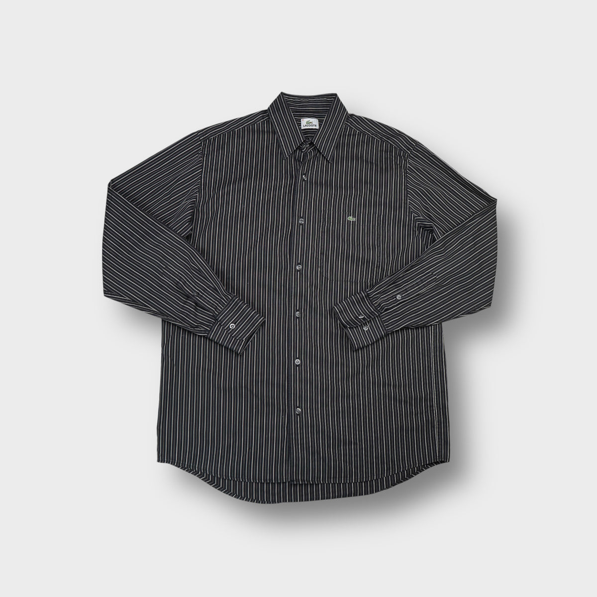 Lacoste long-sleeve shirt in black and white stripes with crocodile logo on chest
