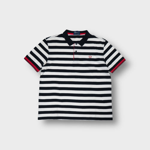 Fred Perry polo shirt in black and white stripes with a red embroidered laurel wreath logo.