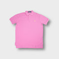 Ralph Lauren polo shirt in pink featuring a yellow embroidered pony logo on the chest