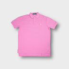 Ralph Lauren polo shirt in pink featuring a yellow embroidered pony logo on the chest