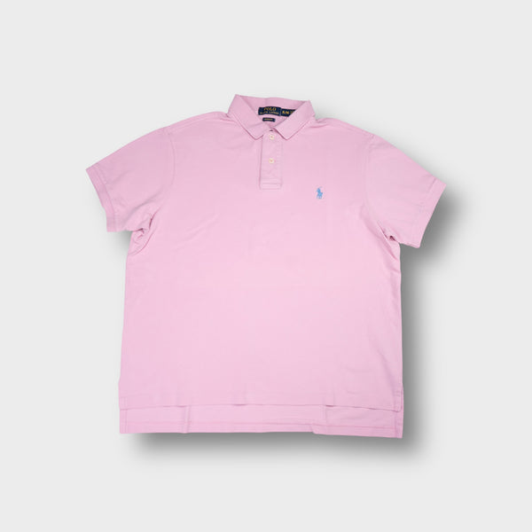 Ralph Lauren polo shirt in pink featuring a blue embroidered pony logo
