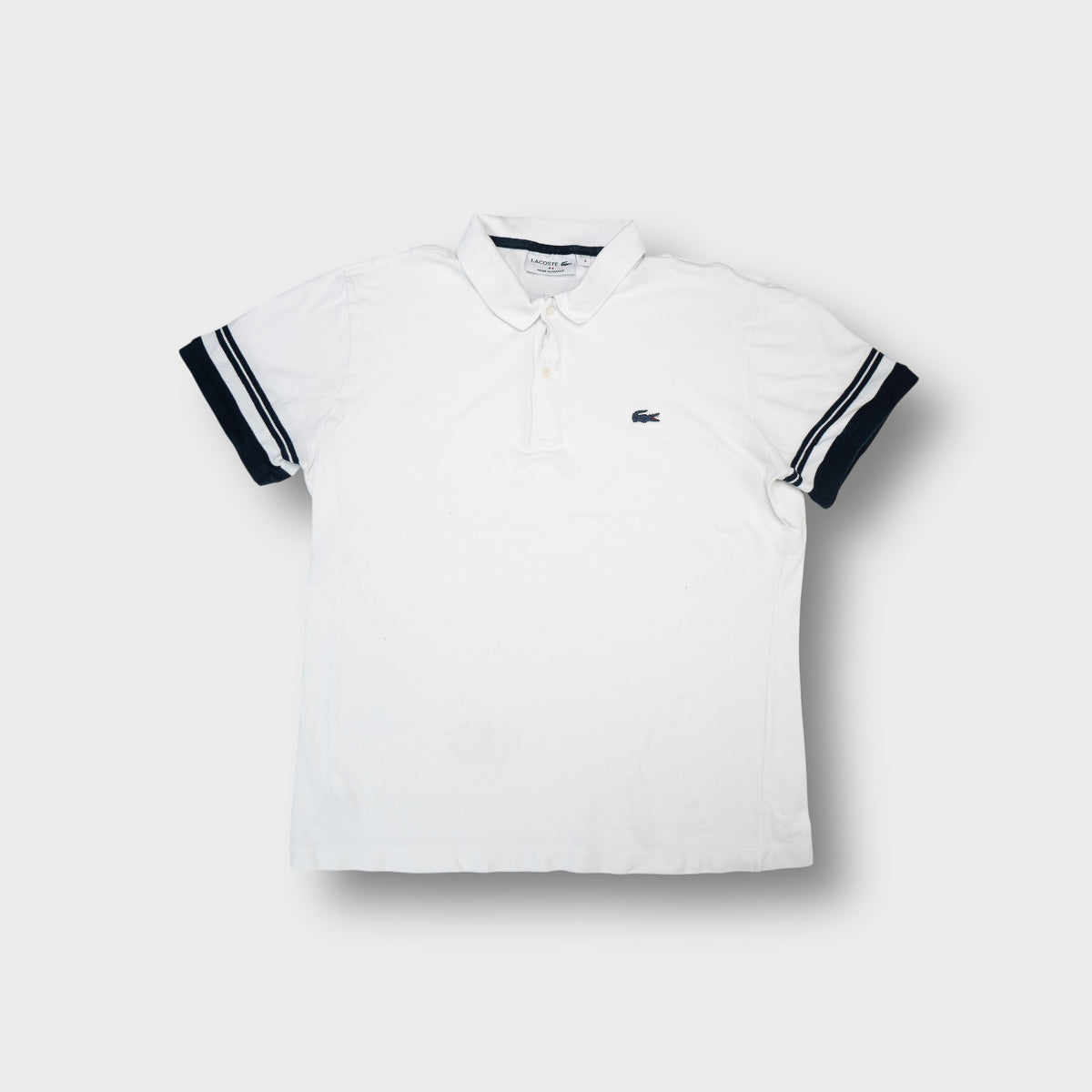 Lacoste polo shirt in white with navy cuff stripes and embroidered crocodile chest patch