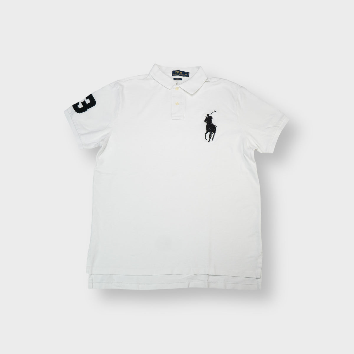 Ralph Lauren polo shirt in white with a large black embroidered pony logo