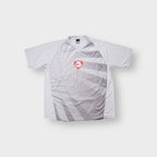 Nike Dri-FIT T-Shirt in white and grey with a red shield logo on the front panel