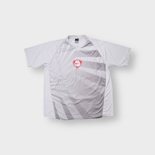 Nike Dri-FIT T-Shirt in white and grey with a red shield logo on the front panel