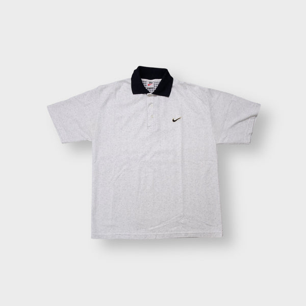 Nike polo shirt in grey with a contrasting black collar and embroidered chest swoosh logo