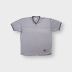 Nike Team T-Shirt in grey with black V-neck collar and center swoosh logo
