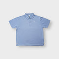 Nike polo shirt in light blue with an embroidered Nike Court tennis court logo on the chest.