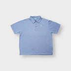 Nike polo shirt in light blue with an embroidered Nike Court tennis court logo on the chest.