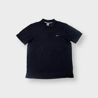 Nike polo shirt in black featuring a white swoosh logo embroidered on the chest