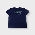 Nike T-Shirt in navy blue with a green outline logo graphic on the chest