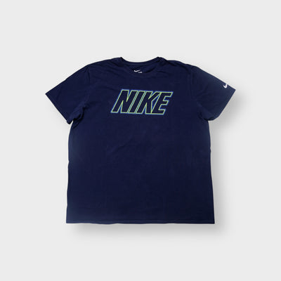 Nike T-Shirt in navy blue with a green outline logo graphic on the chest