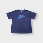 Nike T-Shirt in blue featuring a graphic swoosh logo print on the chest