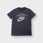 Nike T-Shirt in navy featuring a white printed slogan and Swoosh logo on the front