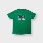 Nike T-Shirt in green featuring a white distressed Nike Basketball print