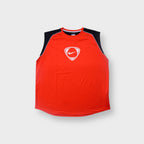 Nike tank top in red and black with a white swoosh logo inside a shield graphic on the chest