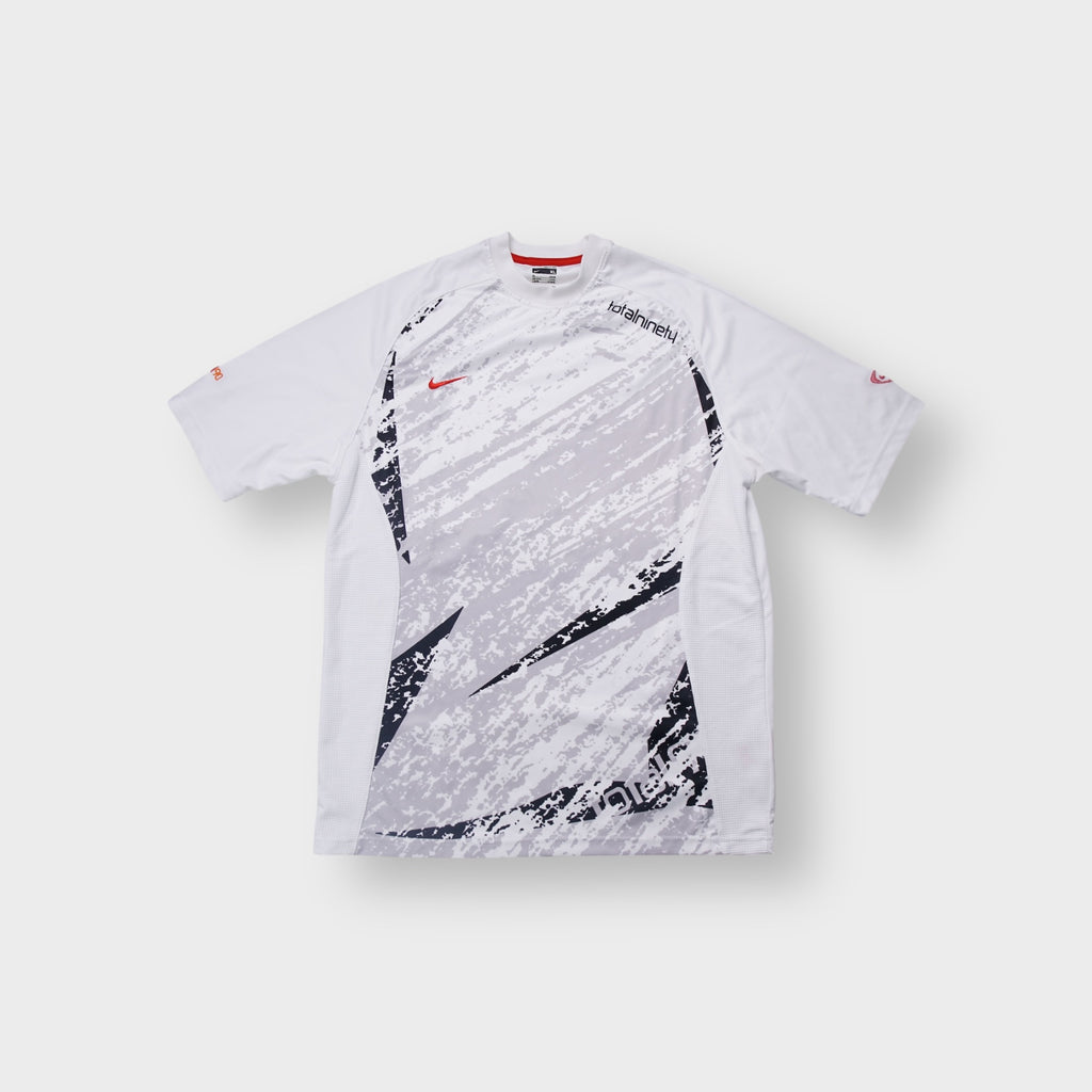 Nike Total Ninety T-Shirt in white and grey featuring front graphic prints