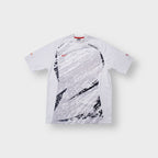 Nike Total Ninety T-Shirt in white and grey featuring front graphic prints
