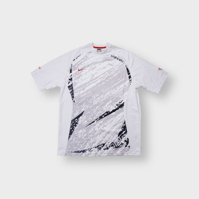 Nike Total Ninety T-Shirt in white and grey featuring front graphic prints