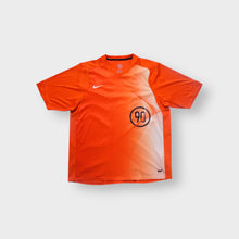Load image into Gallery viewer, Nike T-Shirt in orange with circled Total 90 graphic print and Swoosh logo