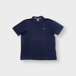 Nike polo shirt in navy with small embroidered white Swoosh logo