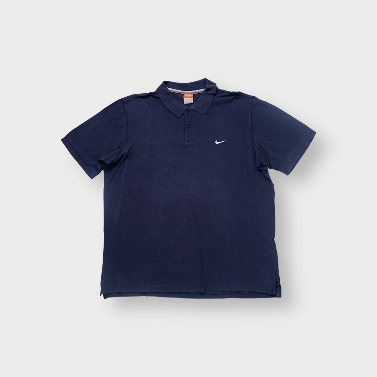 Nike polo shirt in navy with small embroidered white Swoosh logo