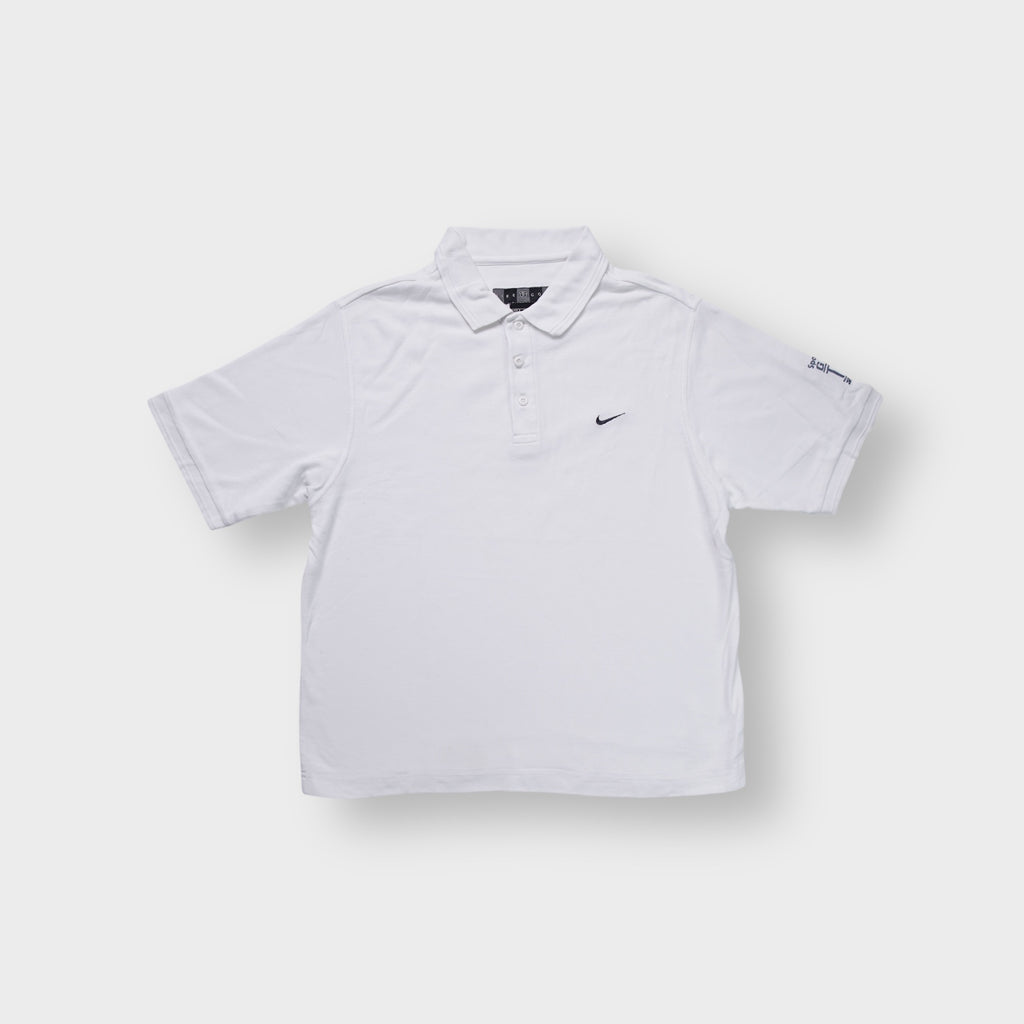 Nike Golf polo shirt in white with a black embroidered swoosh logo on the chest