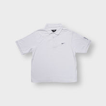 Load image into Gallery viewer, Nike Golf polo shirt in white with a black embroidered swoosh logo on the chest