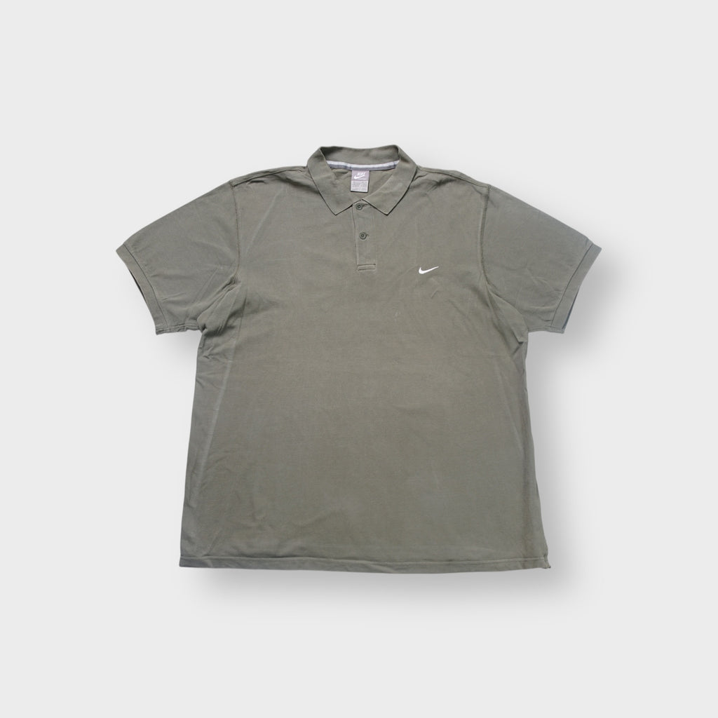 Nike polo shirt in olive green with a small white embroidered Swoosh on the chest