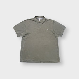 Nike polo shirt in olive green with a small white embroidered Swoosh on the chest