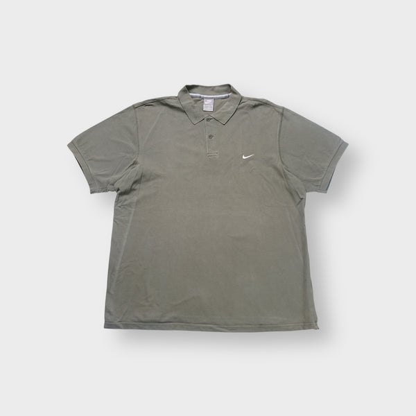 Nike polo shirt in olive green with a small white embroidered Swoosh on the chest