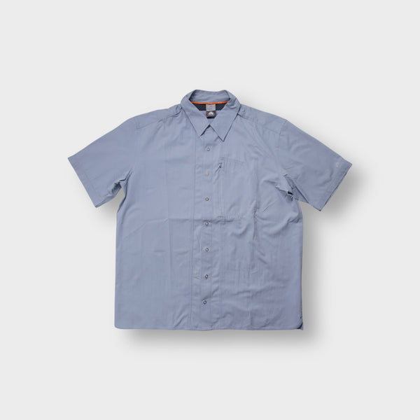 Nike ACG short-sleeve shirt in grey with zippered chest pocket and sleeve logo