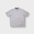 Nike short-sleeve shirt in grey with chest pockets and button-front fastening.