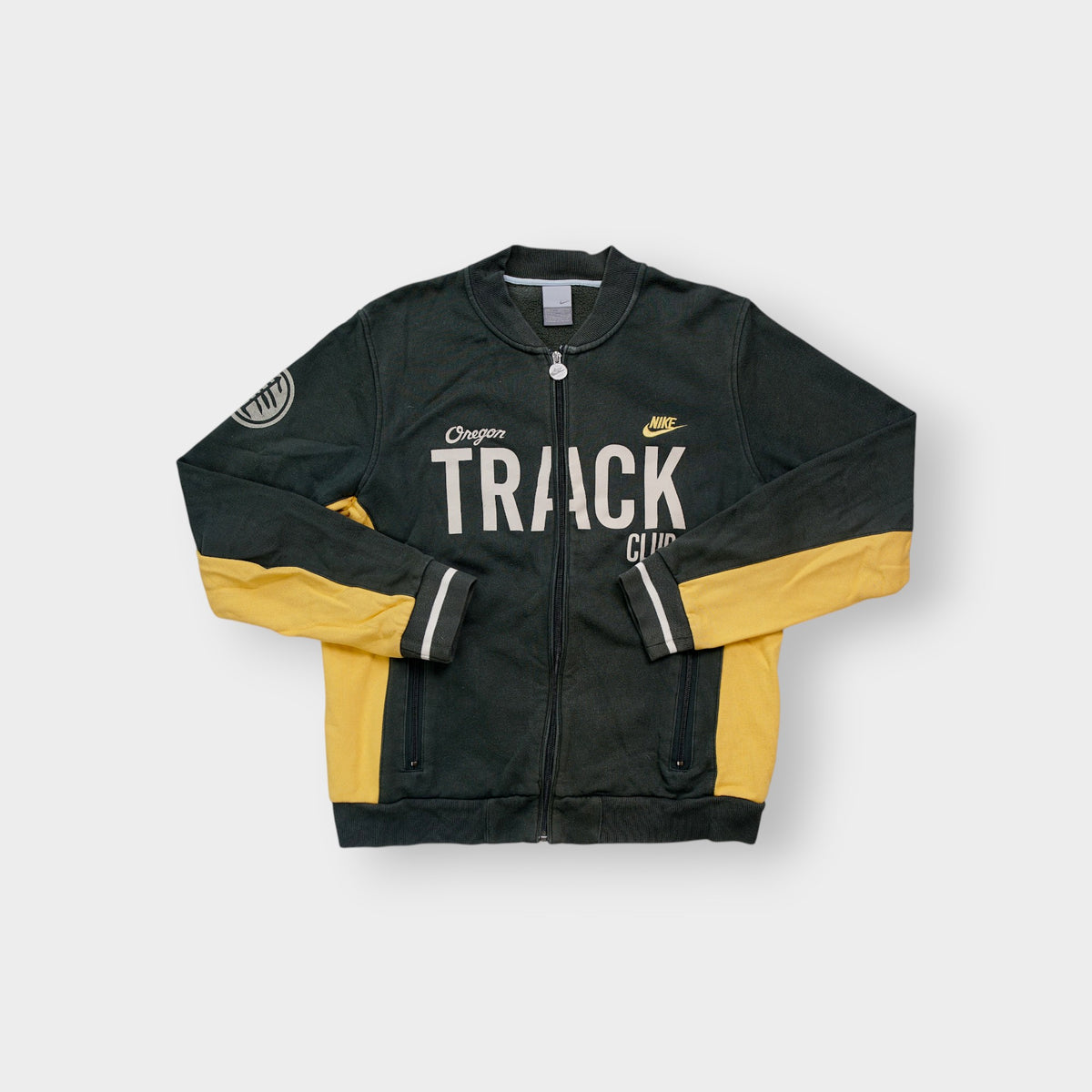 Nike jacket in green and yellow with white Oregon Track Club chest print
