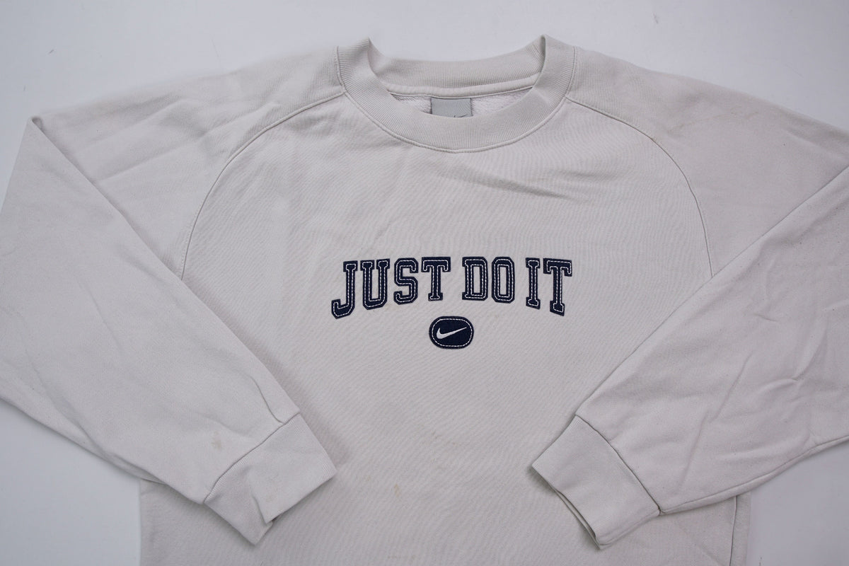 Nike sweater in grey featuring navy Just Do It embroidery and Swoosh patch, full view