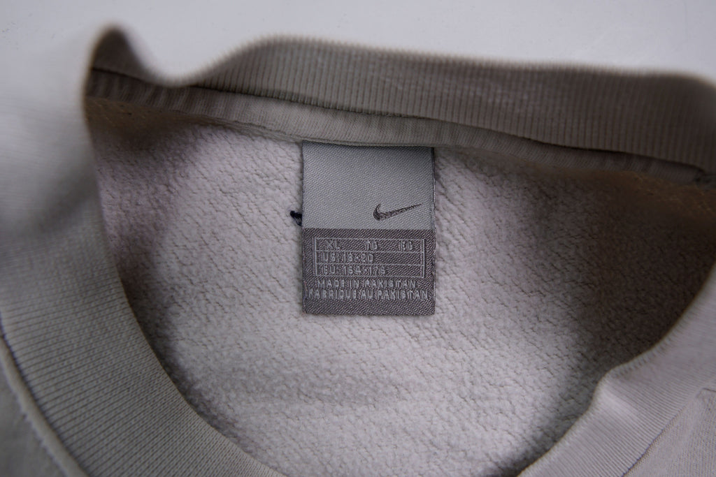 Nike sweater in grey featuring navy Just Do It embroidery and Swoosh patch, size label