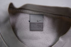 Nike sweater in grey featuring navy Just Do It embroidery and Swoosh patch, size label
