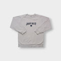 Nike sweater in grey featuring navy Just Do It embroidery and Swoosh patch