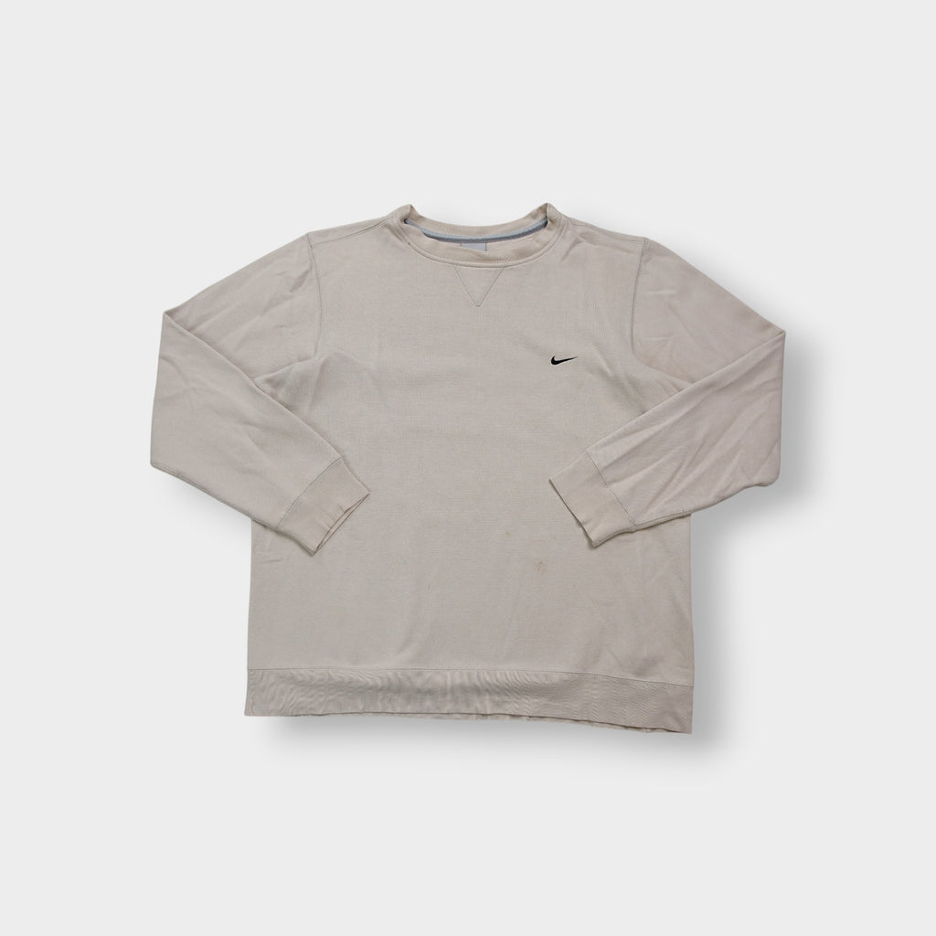 Nike crewneck sweater in beige featuring a small black embroidered Swoosh logo on the chest