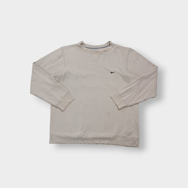 Nike crewneck sweater in beige featuring a small black embroidered Swoosh logo on the chest
