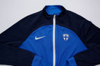 Nike track jacket in blue and navy featuring the Suomi crest on the chest, full view