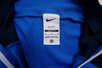 Nike track jacket in blue and navy featuring the Suomi crest on the chest, size label