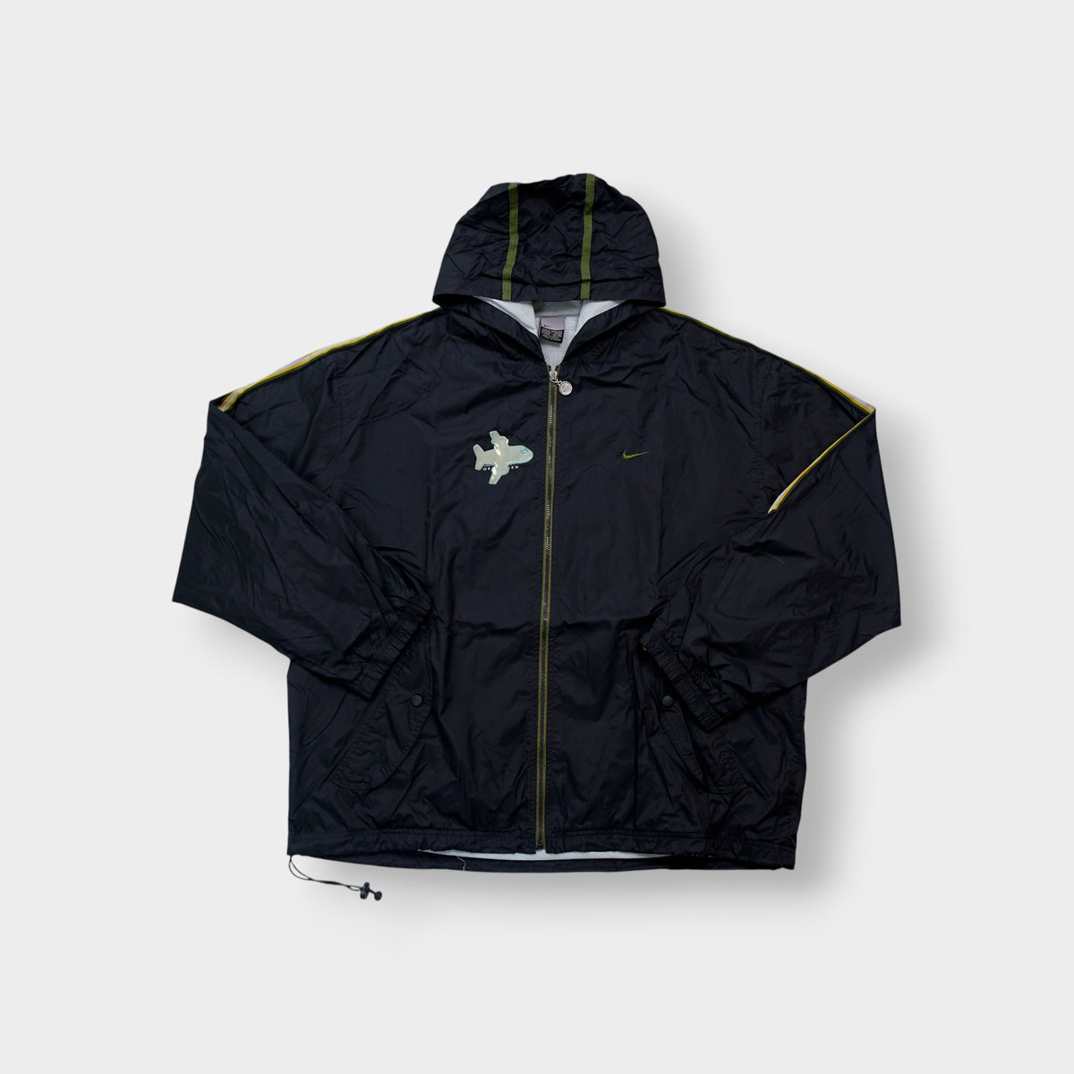Nike black hooded jacket with green piping details and chest airplane patch