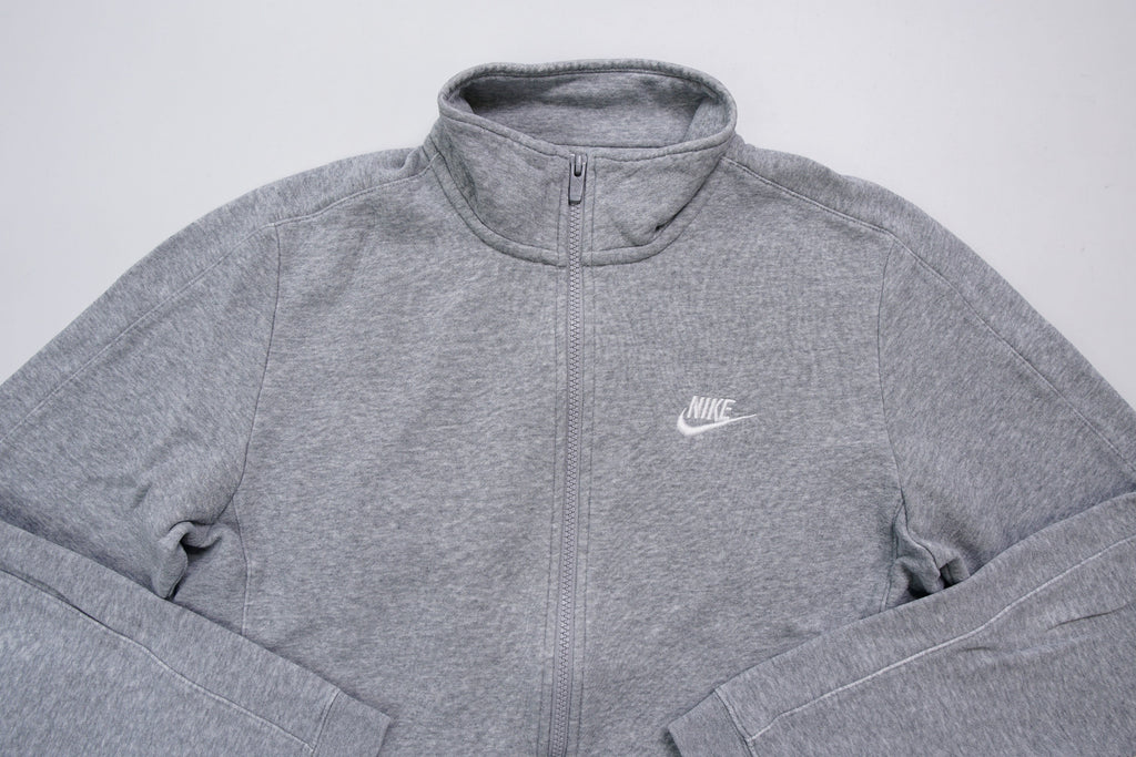 Grey Nike full-zip jacket featuring an embroidered white logo on the chest, full view