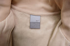 Nike zip jacket in beige featuring a small navy embroidered swoosh on the chest, size label