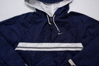 Nike navy jacket featuring a white chest stripe, hooded half-zip, and small embroidered swoosh, detail