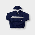Nike navy jacket featuring a white chest stripe, hooded half-zip, and small embroidered swoosh.