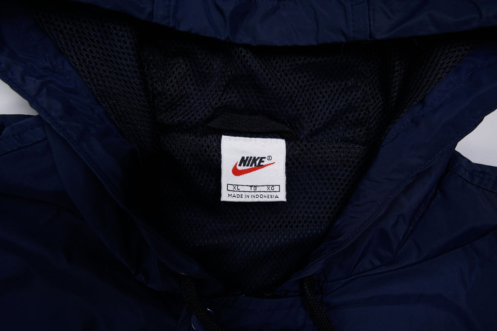 Nike jacket in dark blue and black with hood and white contrast stripes across the chest, size label