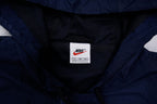 Nike jacket in dark blue and black with hood and white contrast stripes across the chest, size label